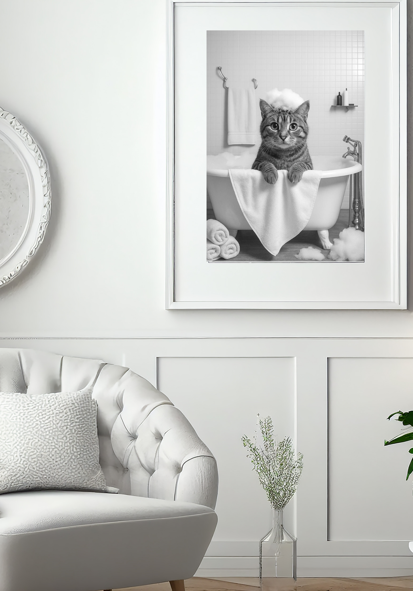Framed artwork of a cat in a bathtub on a wall above a sofa.