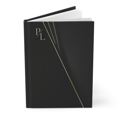 Black notebook with gold accents in a white background