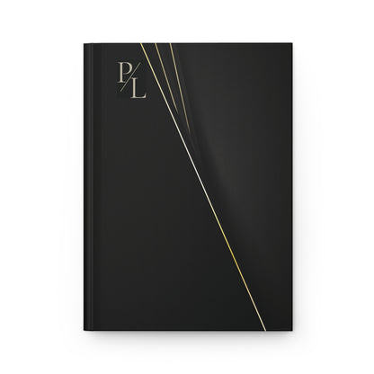Matte black notebook with gold accents and 'P/L' branding on a white background