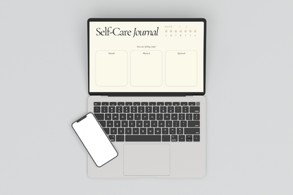 Self-Care Journal displayed on a laptop, in a light gray background