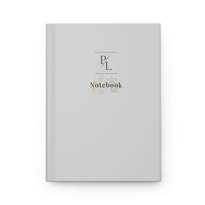 Gray notebook with 'P/L' branding on a white background